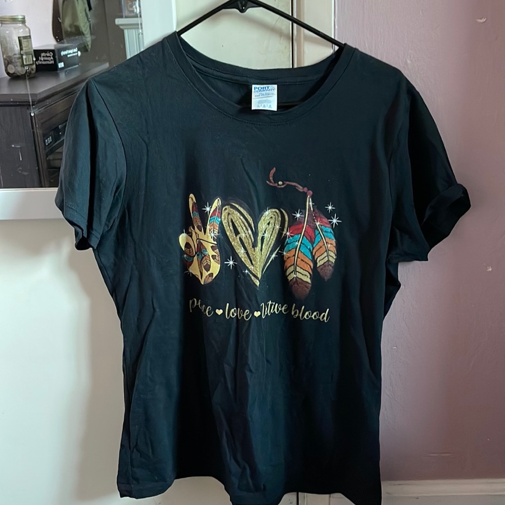 Black Native American T-shirt that says “peace, love, native blood”